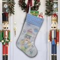 Detailed view of a white Christmas stocking featuring a Nutcracker soldier and gift boxes - Style E