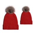 Detail of red matching parent-child knit hats with fluffy pom-poms for winter warmth - Parent-Child Set / Red