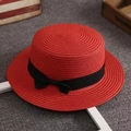 Top-down view of a bright red boater hat with black ribbon bow on rustic background - M (56-58cm) / Red