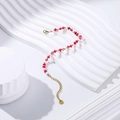 Macro detail of a beaded bracelet with pink stones and stainless steel gold plating - Bohemian Pink & White Beaded Style