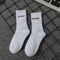 White crew socks with OH YEAH! lettering in classic American streetwear style - Oh Yeah!!