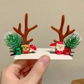 Close-up of Christmas reindeer antler hair clips with bells and festive deer doll decor - 25# Flocked Antler Pine Needle Pair
