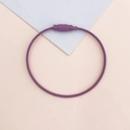Detail of purple coated wire keychain with screw lock on geometric background - Purple