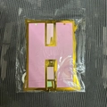 Pink and gold foiled Happy Birthday letter H banner piece in clear retail packaging - Macaron Birthday Banner (No Back Card)