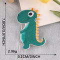Dark green cartoon dinosaur embroidery patch with orange fins, size 7.8cm x 5.1cm - Dark Green Dinosaur