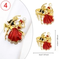 Golden napkin ring featuring a dancing couple with red enamel dress and rhinestone details - Ballet Dancer Red Skirt