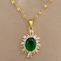 Detailed macro view of a gold-tone titanium necklace with green oval stone and white gems - D335 Necklace (Titanium Steel Chain Copper Pendant)