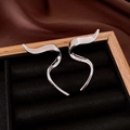 S-shaped silver earrings with polished wave design displayed on black velvet lining - Silver Modern Wave Ribbon Ear Jewelry (73#)