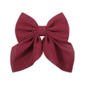 Detailed view of wine red floral bow hair clip with elegant diamond pattern texture - Burgundy