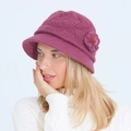 Close-up of knit wool winter hat with 3D floral accent in vibrant purple finish - Rose Red