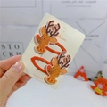 Detail of Christmas reindeer hair clips with glitter fabric on a branded display card - Reindeer BB Clips