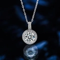 Detailed close-up of a silver halo pendant with a brilliant cut center stone on blue background - Xl-57 [with Cross Chain]