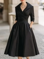 Detail of the black elegant V-neck maxi dress with long sleeves and side pockets - S / Dresses / Black