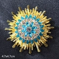 Luxurious sunburst brooch with blue marquise crystals and golden frame, size 4.7x4.7cm - Crystal Sparkling Flower