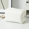 Detailed view of white PU leather makeup bag with vertical quilted texture and zipper - 16*9*9cm / White