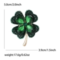 Golden clover brooch with green rhinestones including size dimensions and weight info - Green