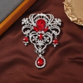 Vintage silver flower brooch featuring a deep red gemstone and intricate filigree design - Style 3 (Ruby Red + Silver)