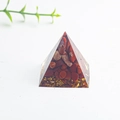 Pyramid orgone crystal with red jasper chips and gold foil on white background - Red Jasper Type 2