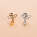 Detail of butterfly nose studs in gold and silver finish with sparkling cubic zirconia - Style 12# (Hollow Butterfly)