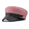 Detail van de roze keperstof en zwarte lederen klep van de baker boy pet voor dames - M / Roze