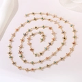 Detailed view of golden chain necklace with colorful evil eye cross charms in a spiral layout - Cross Evil Eye Chain (Style 3) / Length approx. 1m