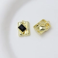 Detailed view of rectangle zircon pendants with gold metal base and black gemstone - Style 31