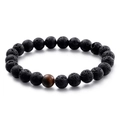 Bracciale elastico con perle di pietra lavica nera e una pietra occhio di tigre - Pietra Vulcanica + Occhio di Tigre