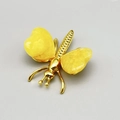 Handcrafted golden butterfly ornament featuring polished yellow crystal gemstone wings - Topaz