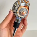 Handcrafted conch shell wine bottle stopper with spiral texture and metal sealing - South African Turban Stopper