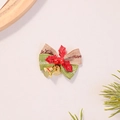 Close-up of burlap Christmas bow with golden bells, red berries and Merry Christmas print - Green Linen with Red Leaves