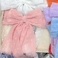 Polka dot Swiss dot chiffon bow hair clip in various macaron colors on tray - Pink