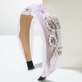 Close-up of lavender mesh headband featuring faux pearls and crystal flower details - Light Purple
