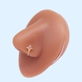 Close-up of gold nose stud with pink heart zircon on a realistic skin model - Gold Winged Pink Heart (#15)