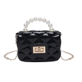 Kids black jelly handbag with quilted pattern and pearl handle on white background - Black