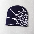 Close-up of knit texture and spider web jacquard pattern on the purple beanie - One Size / Navy Blue