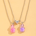 Close-up of cute luminous turtle pendants with magnetic heart clasp on silver bead chains - Luminous Magnetic Necklace Set / Pink and Purple Turtle (Luminous) (White K1465)