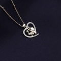 Golden heart necklace with family figure pendant and shimmering diamond-set edges - Family Couple Heart