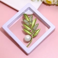 Green leaf brooch with rhinestones and pearl detail in a white display case - XZ065-Green Leaf Rhinestone-Boxed