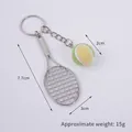 Miniature tennis racket and ball keychain in bright yellow with silver finish - 2cm Small (Light Green + Light Yellow) Dual-tone Tennis Ball + Silver Racket