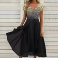 Detailed view of black dress featuring gold sequins, V-neck design and chiffon skirt - S / Tops / Gold Sequin Black