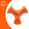Durable orange rubber rugby-shaped dog toy with textured bumps for dental cleaning - Triangular Food Dispenser / Orange