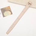 Detailed view of a beige leather wrist strap for DIY phone cases on a clean tray - Without Rivets / Ivory