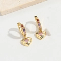 Detail of heart-shaped colorful zircon earrings with gold finish on a stone display - Heart Style (ES2648)