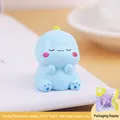 Hellblaue Cartoon-Dinosaurier-Figur mit geschlossenen Augen und süßen rosa Wangen - Blau (4A)