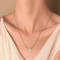 Minimalist gold heart pendant necklace with shimmering zircon stones on a model - KC Gold Full Diamond Heart (S68)
