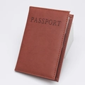 Brown PU leather passport cover with embossed PASSPORT text and stitched edges - Earthy Yellow