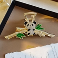 Elegant gold metal hair claw clip featuring a panda eating bamboo with crystal accents - Panda Eating Bamboo Rhinestone Claw