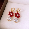 Detailed macro view of 18k gold vintage flower earrings with zircon and red enamel - Red Flower Ear Clip (Gold Plated)