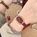 Elegant ladies watch with gold oval case and red leather strap on a wrist - Gold/Red (Oval Minimalist)