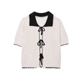 Polo en maille crochetée blanche avec nœuds noirs et finitions ondulées élégantes - S / Blanc cassé avec noir
